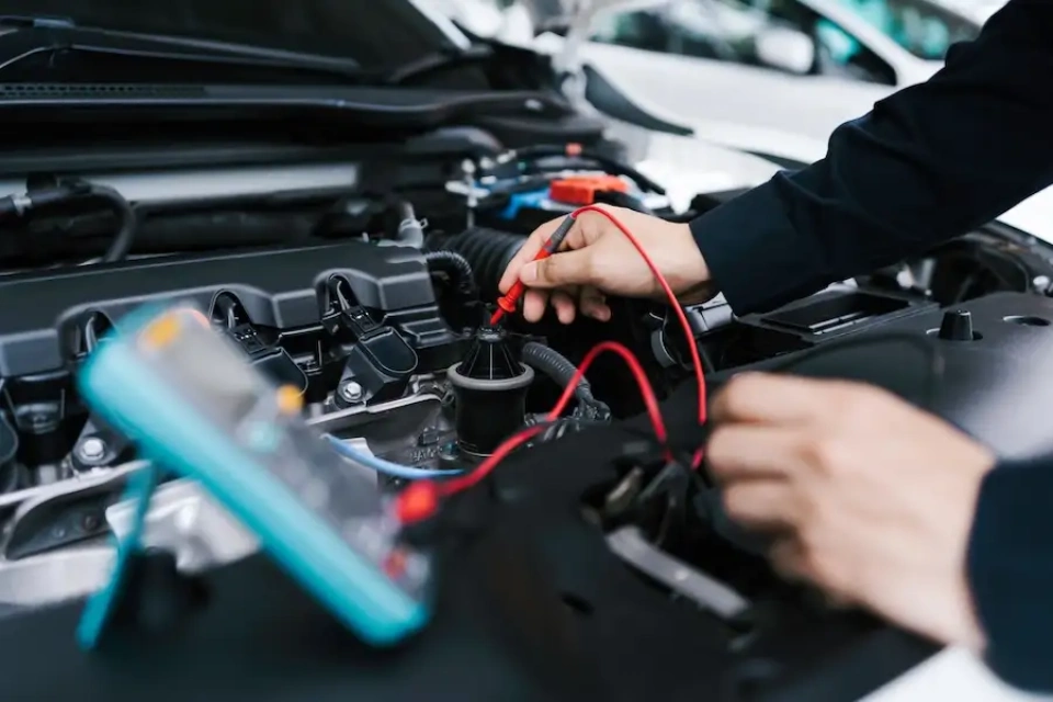 repairman examining in car repair garage Dubai