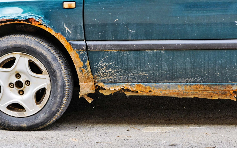 An image showing humidity causing corrosion—rusted parts, electrical issues, and higher car insurance claim risk.
